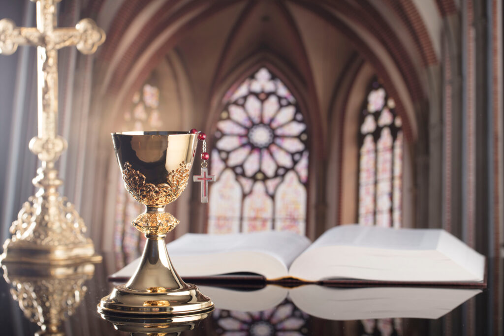 Golden Chalices on the Altar, Bible, and Cross